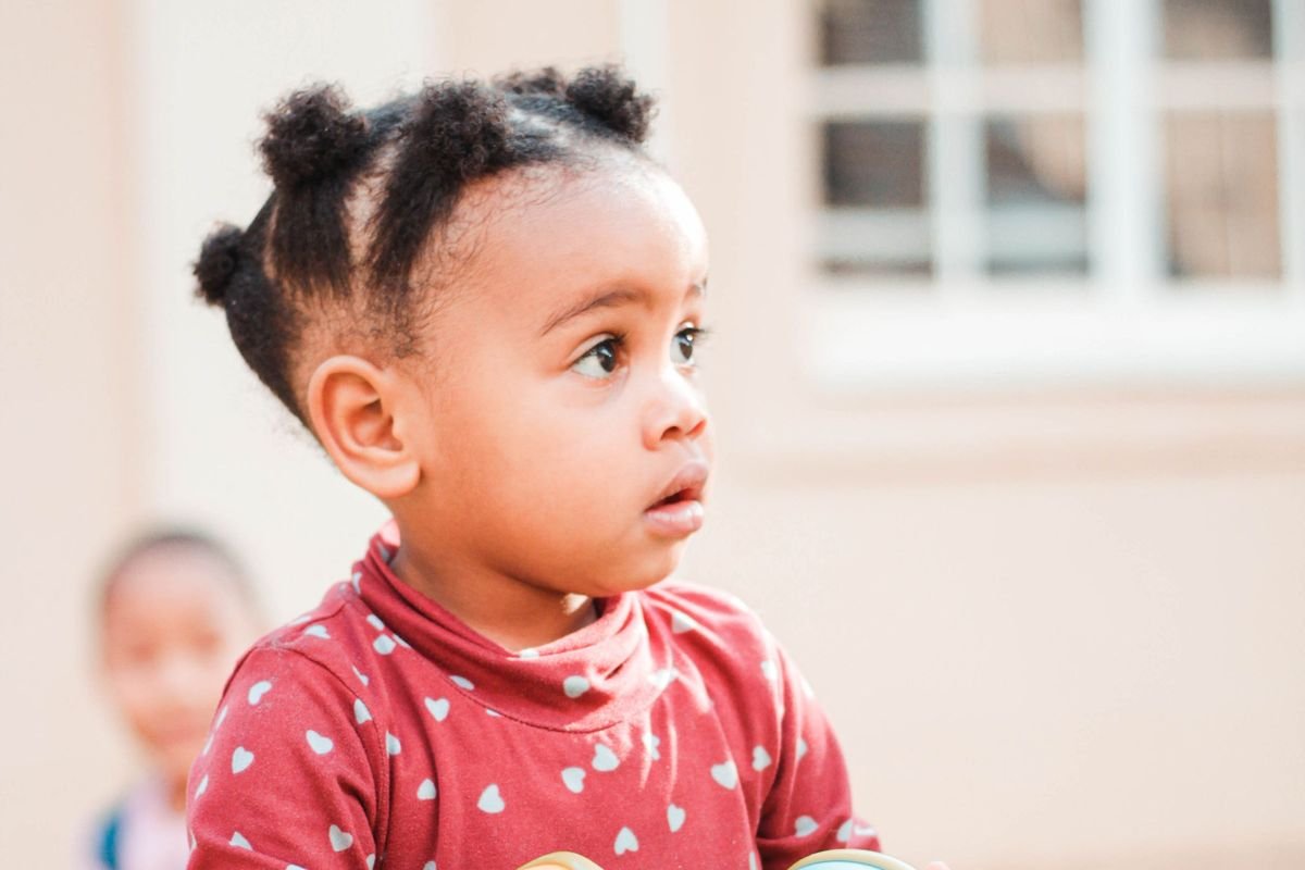 Curious toddler looking across the room